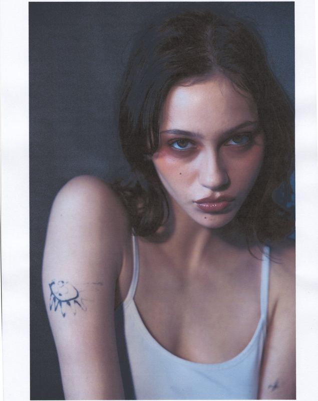 Seated in a white tank top, Anti Agency Editorial by David Spector