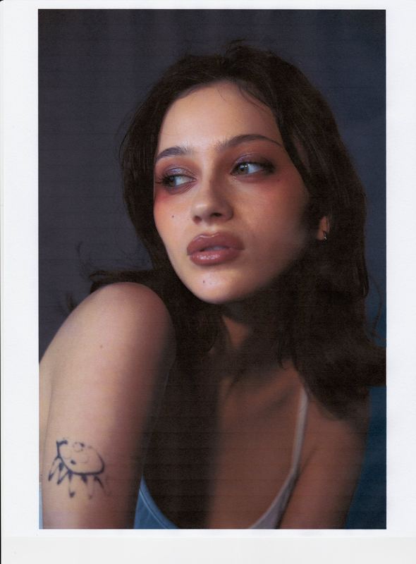 Glancing sideways, arm tattoo showing, Anti Agency Editorial by David Spector
