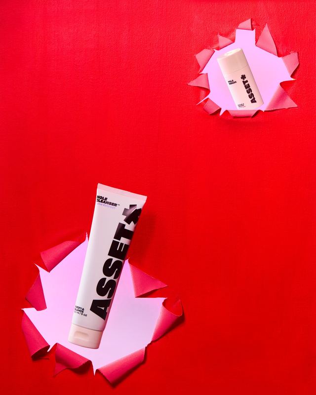 Tube bursting through red paper, Asset by David Spector