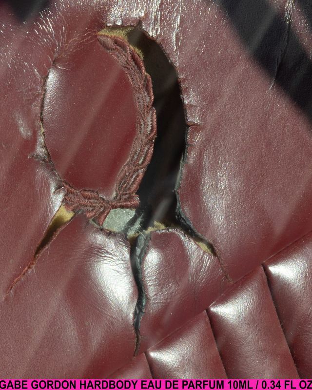 Vial through torn leather, Gabe Gordon Hardbody by David Spector