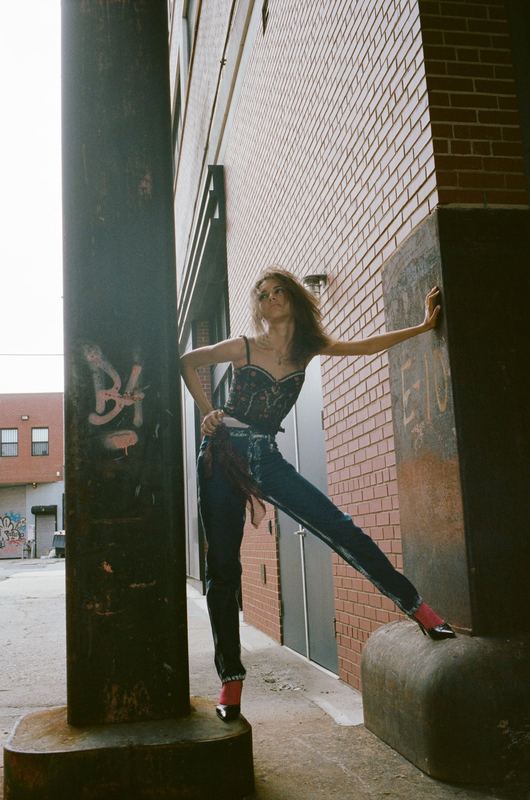 Leaning on a pillar, Lala Olsson by David Spector