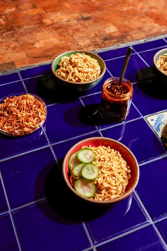 Noodle bowls on blue tile, Momofuku by David Spector