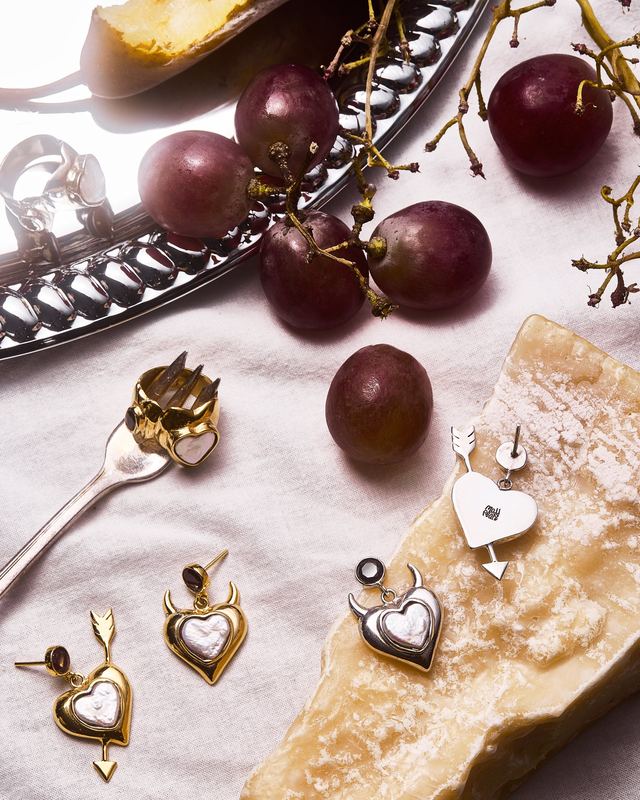 Cross pendant with cheese and plums, Mudpearl by David Spector