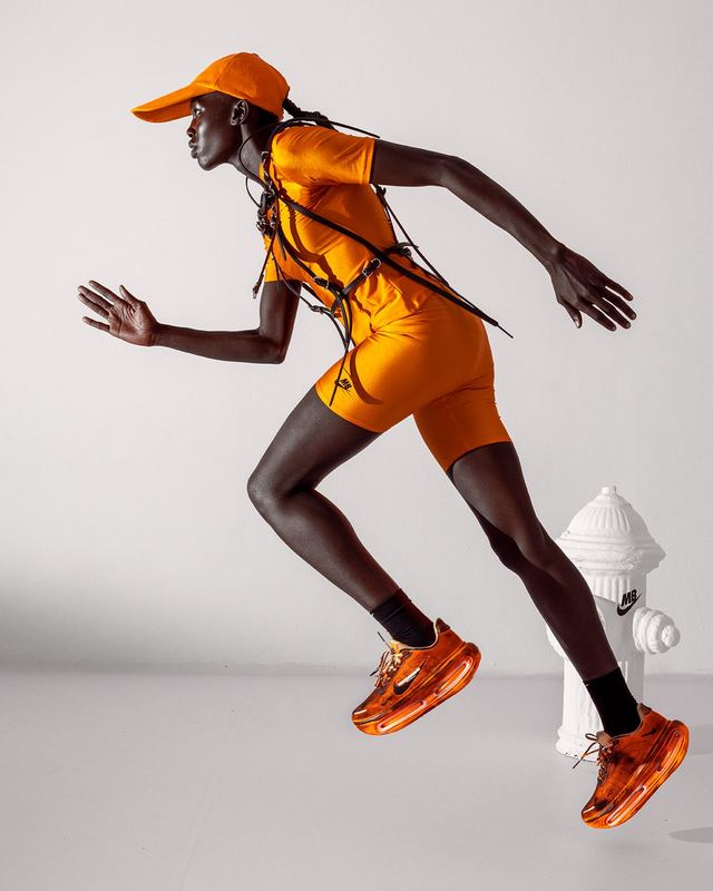 Mid-stride in orange, Nike x Melitta Baumeister by David Spector