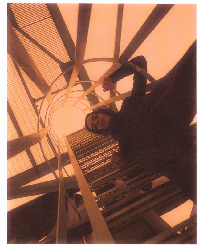 On a spiral stair under orange sky, Orange Sky Portraits by David Spector