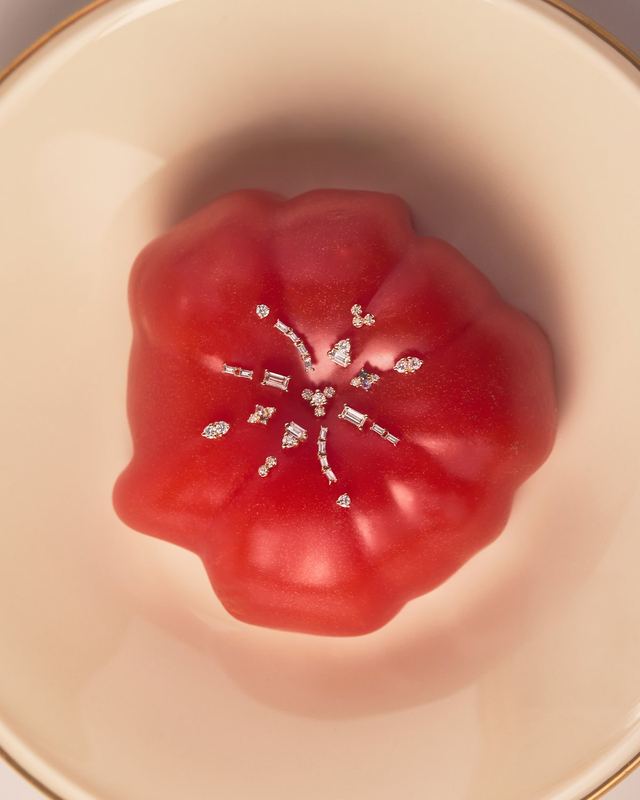 Earrings pinned in a red tomato, Wwake Summer by David Spector
