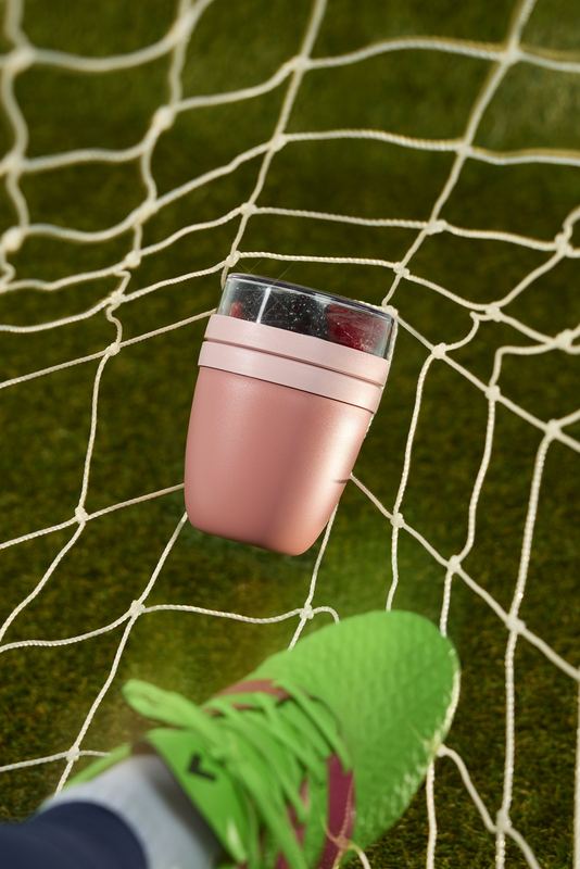 Pink snack pot caught in a soccer net, Bon Appétit by David Spector
