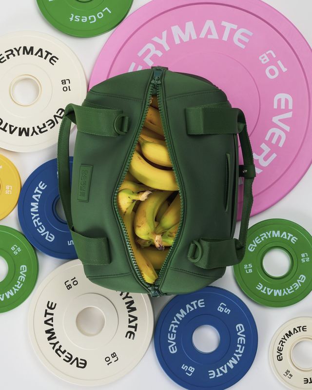 Green duffel of bananas on weight plates, Bon Appétit by David Spector