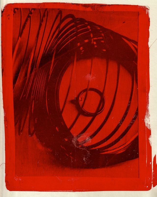Ring inside a coiled spring, red print, Cartier Gelli Prints