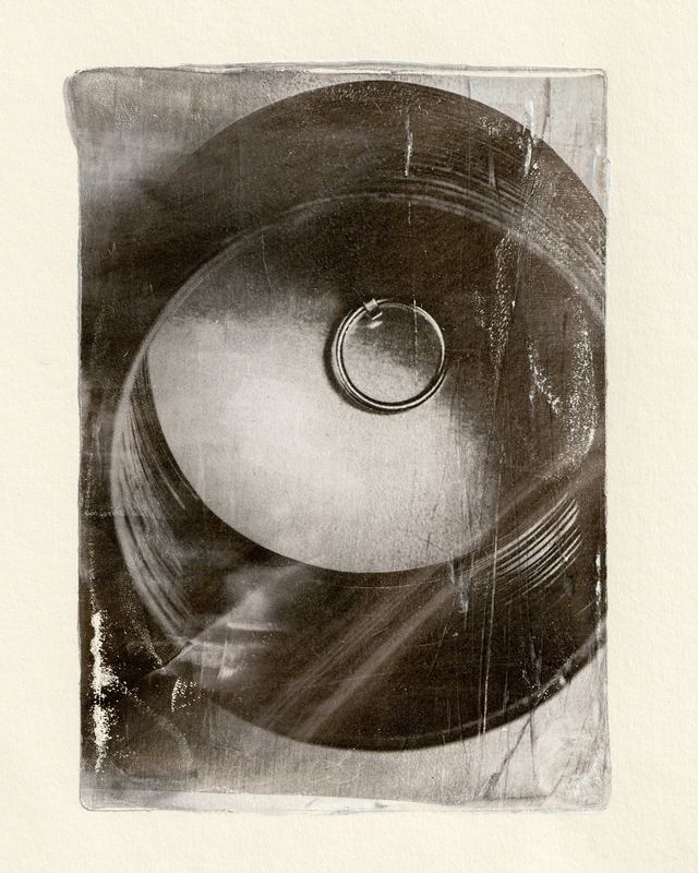 Ring in a curved bowl, black print, Cartier Gelli Prints by David Spector