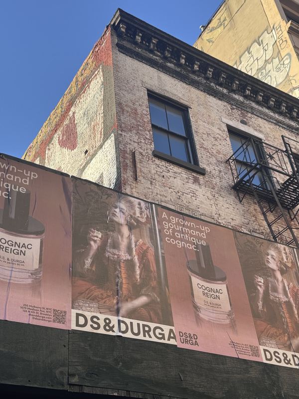 Cognac Reign wheatpastes on a New York building, Cognac Reign by David Spector