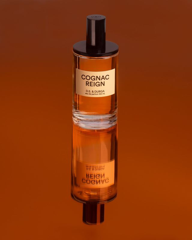 Bottle standing on its reflection, Cognac Reign by David Spector