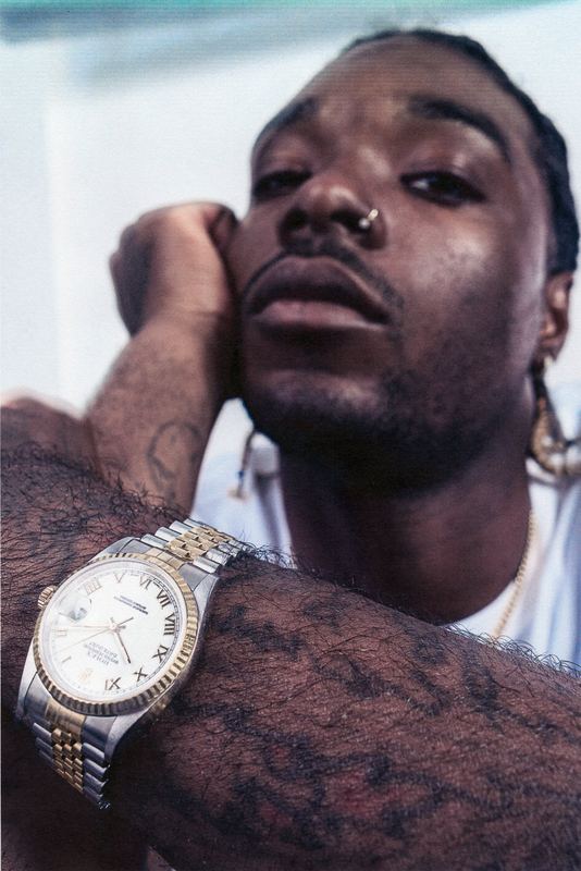 Portrait, gold watch on a tattooed arm, Dimepiece by David Spector