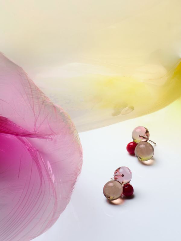 Two beaded earrings beside a pink petal, Keane Art Deco by David Spector