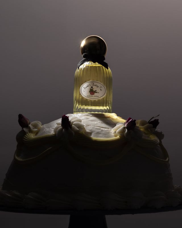 Bottle on a frosted cake in shadow, Marissa Zappas by David Spector