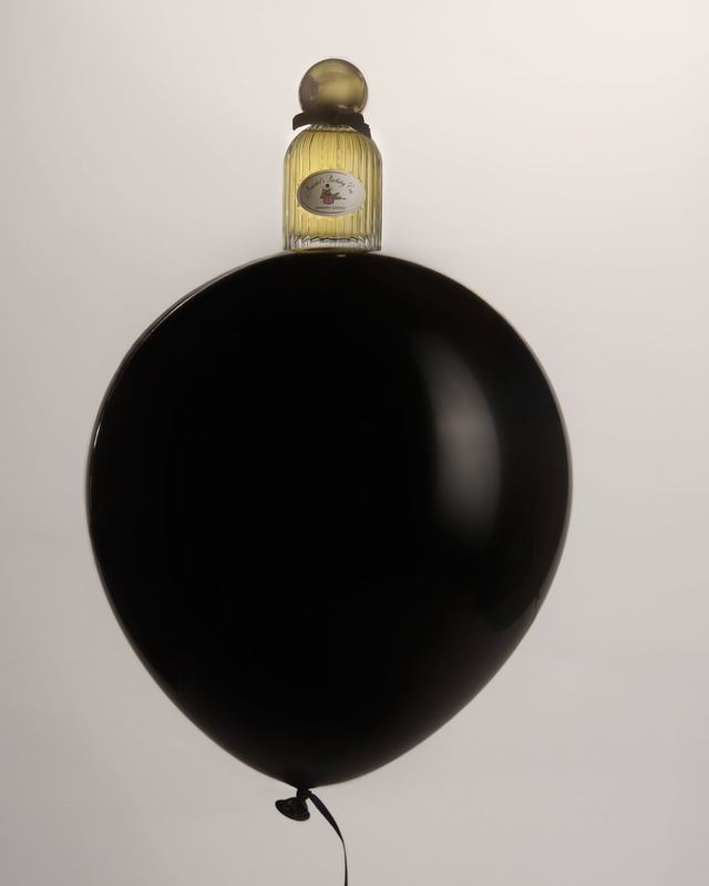 Bottle balanced on a black balloon, Marissa Zappas by David Spector