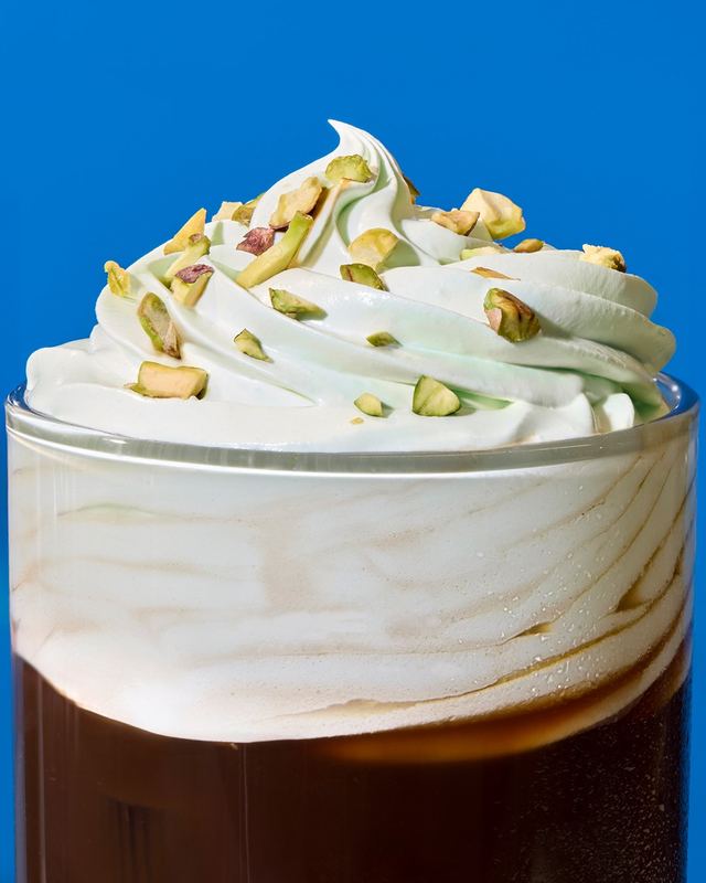 Whipped cream and pistachio, close up, Nespresso by David Spector