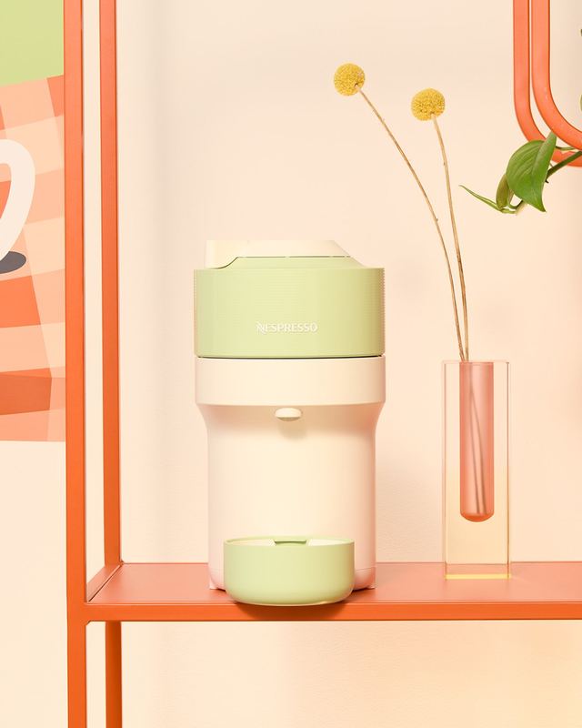 Pale green machine on an orange shelf, Nespresso by David Spector