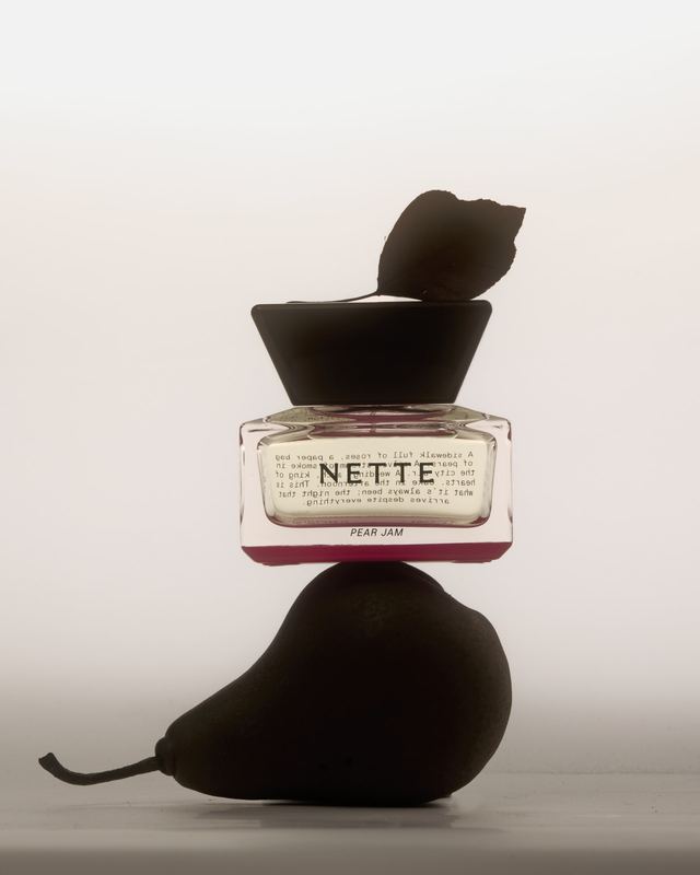 Pear Jam balanced on a dark pear, Nette by David Spector