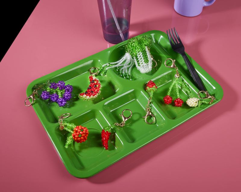 Beaded charms on a lunch tray, Susan Alexandra by David Spector