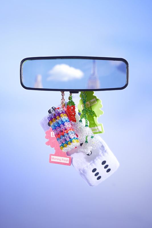 Beaded charm hanging from a rearview mirror, Susan Alexandra by David Spector